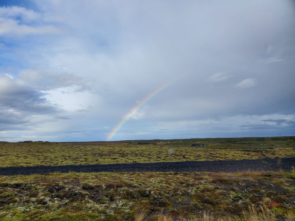 rainbow over lava fields