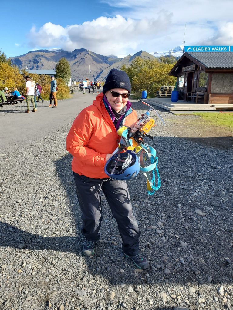 Susan carrying her glacier hiking gear