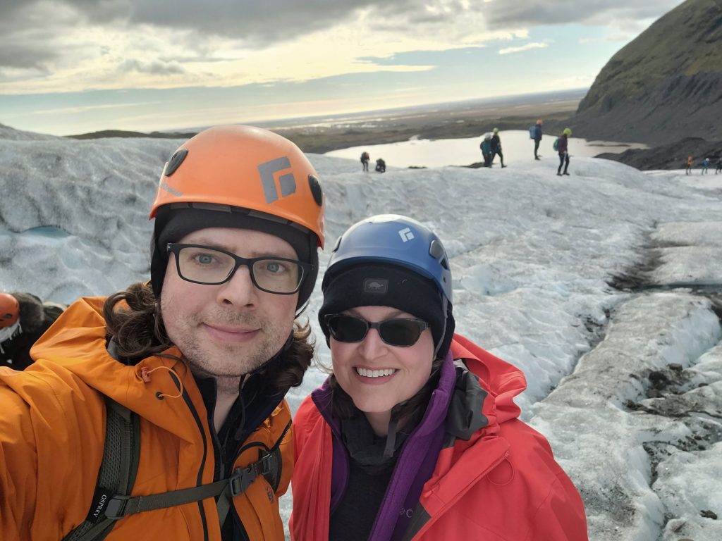 Graham and Susan on the glacier with meltwater pond