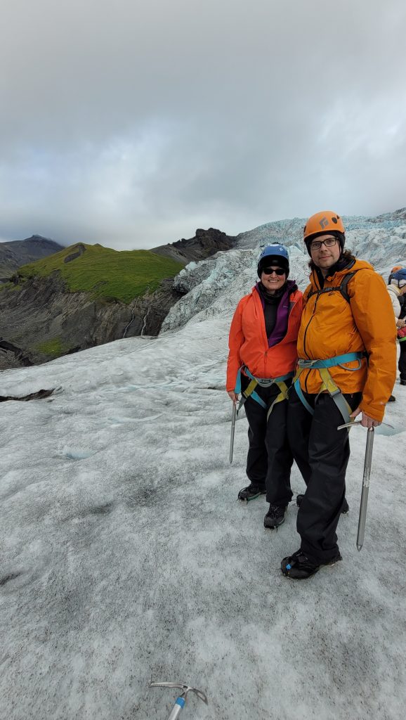 Susan and Graham standing on a glacier.