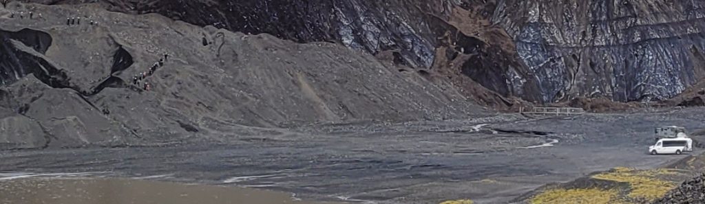 people hiking down a mountain