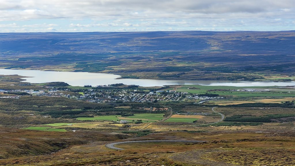 town in distance beside a river