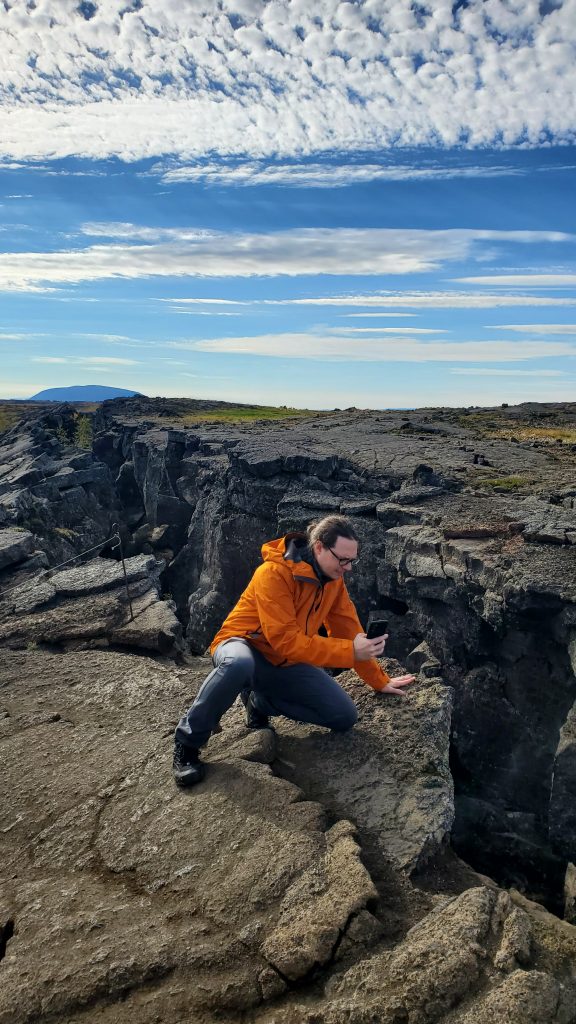 Graham photographing top of cave