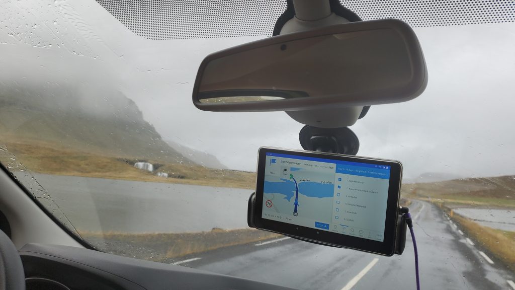 camper van with navigation with waterfall through windshield