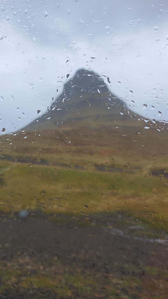 Kirkjufell mountain through a rainy window