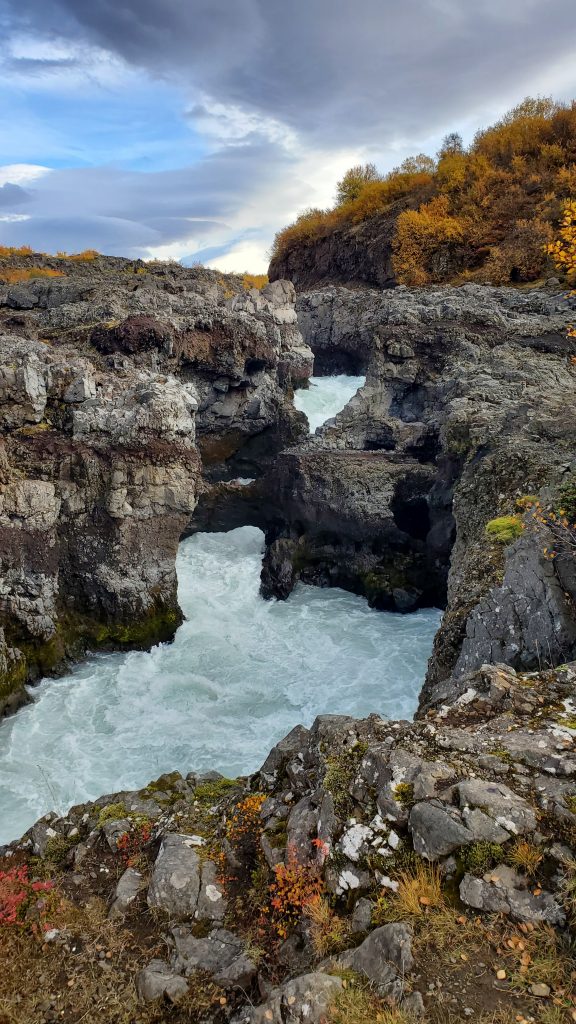 waterfalls with pale blue water