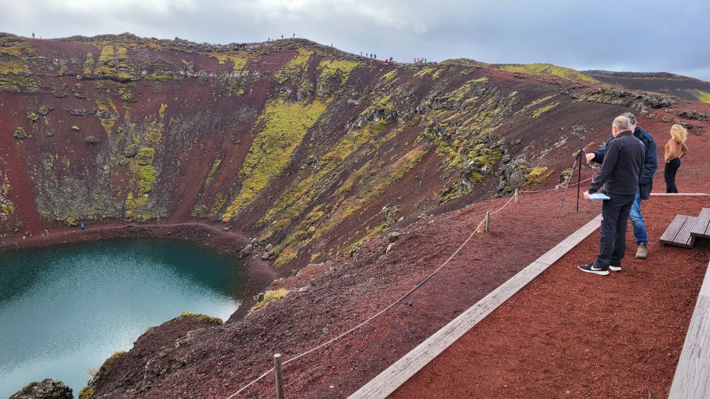 People standing at the top of the crater